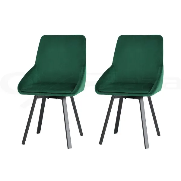 two green velvet dining chairs on white bakground