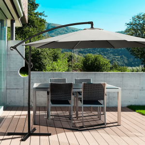 charcoal cantilever umbrella open on outdoor deck covering table and chairs