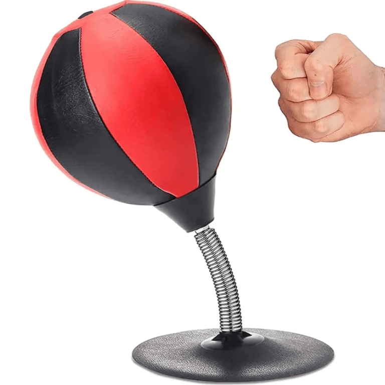 punching bag desk toy on white background with fist