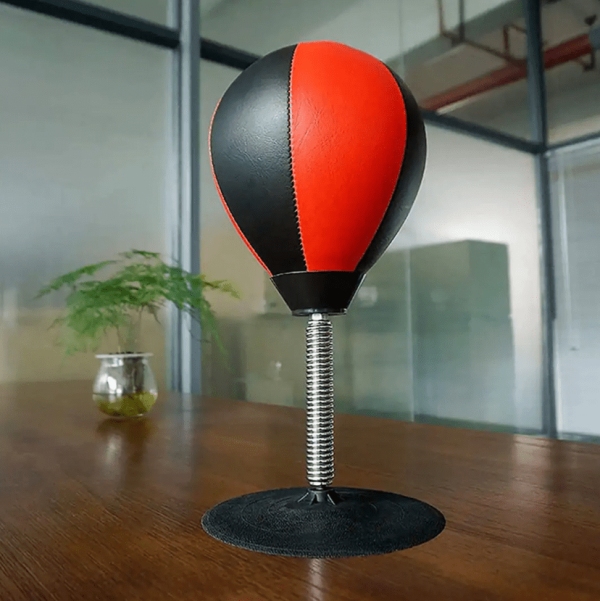 punching bag desk toy on wooden table