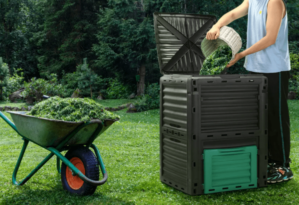 certa compost bin with hands puring mulch in garden
