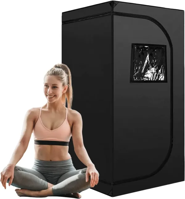 Portable Sauna Tent Black with woman sitting cross legged in front on white background